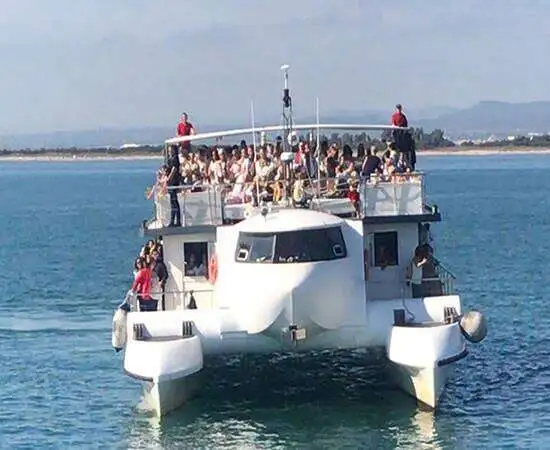 Friends enjoying the sea during a catamaran party in Valencia