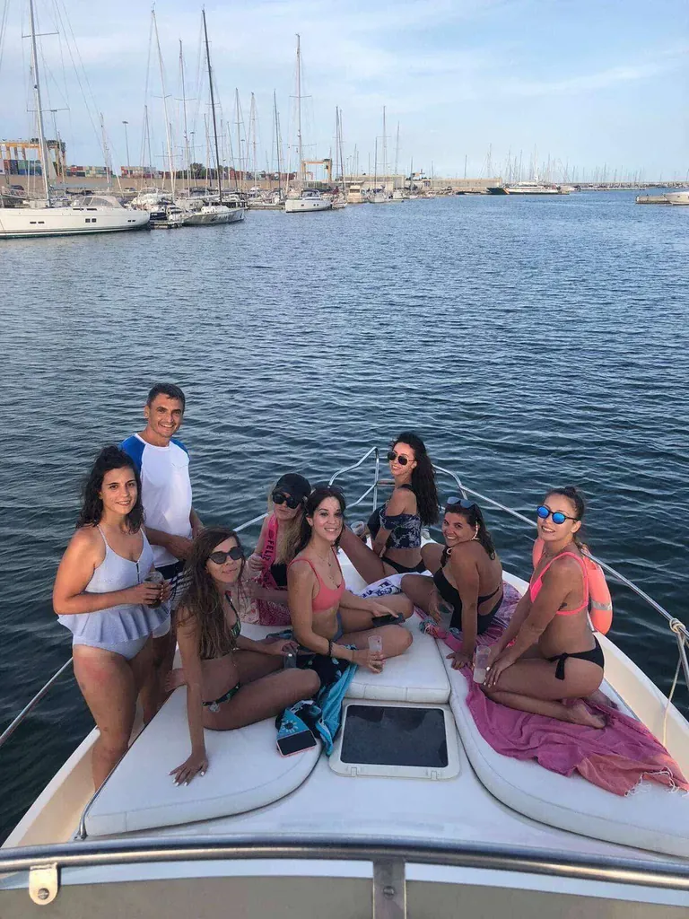 Friends celebrating on a private boat in Valencia Marina